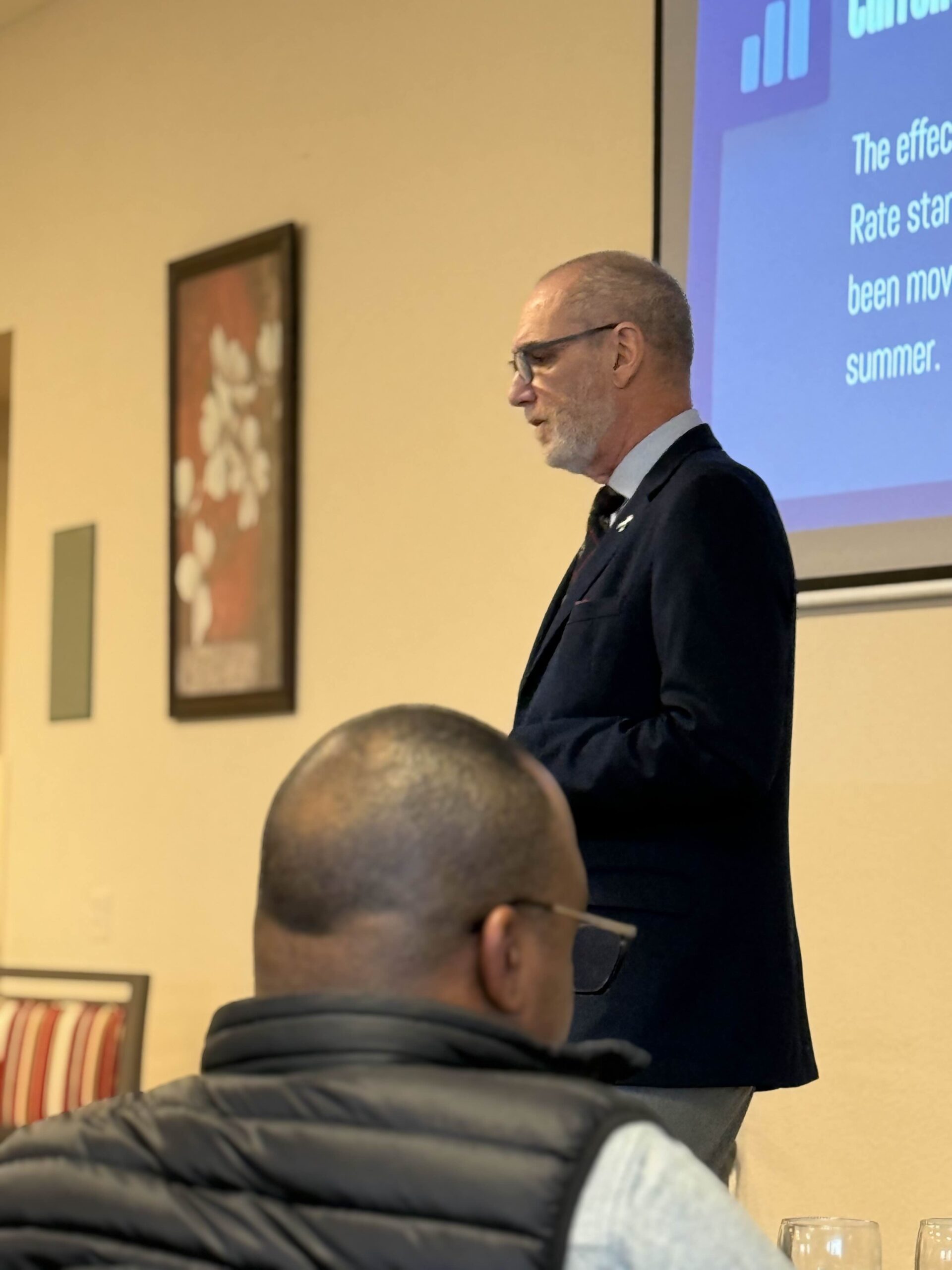 Economist Matthew Gardner presents the 2026 Economic Forecast at the Renton Chamber of Commerce breakfast, hosted at GenCare Lifestyle.