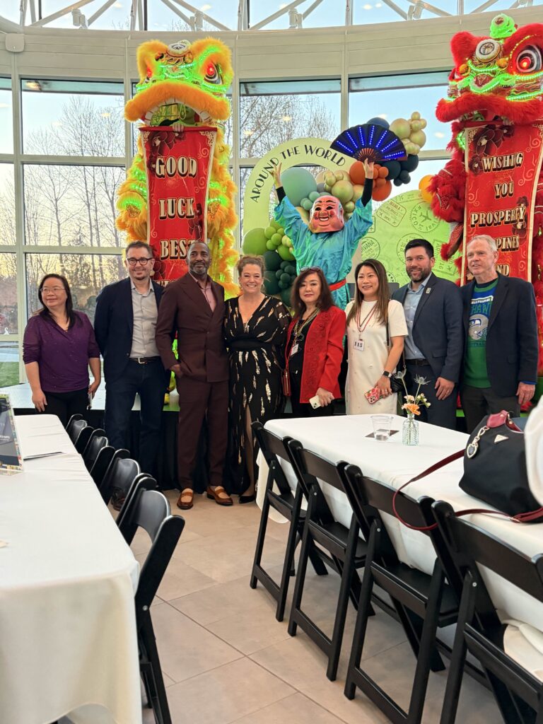 Leaders at the 26 Renton Chamber gala pose with Seattle Shaolin Kung Fu lion dancers